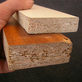 Section view of veneered particle board; link to article: spotting solid wood